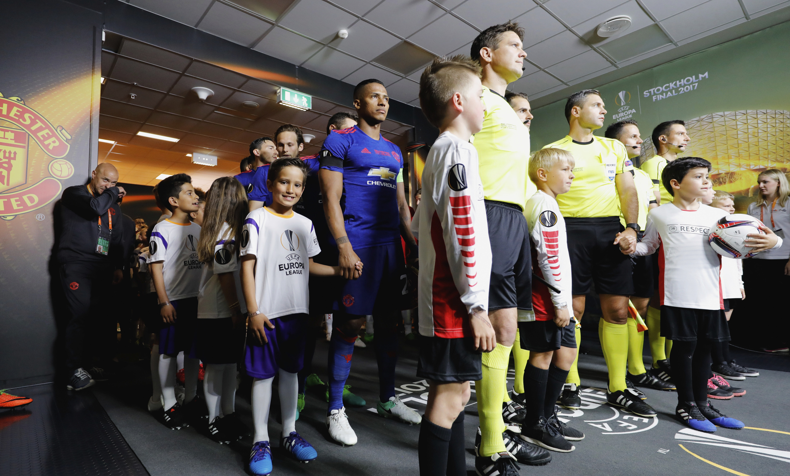 STOCKHOLM, SWEDEN - MAY 24:  The match officials prepare to lead the two teams out prior to the UEFA Europa League Final between Ajax and Manchester United at Friends Arena on May 24, 2017 in Stockholm, Sweden.  (Photo by Simon Hofmann - UEFA/UEFA via Getty Images)
