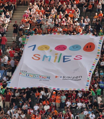 BERLIN, GERMANY - JUNE 25: 10.000 smiles campaign UEFA Foundation during the UEFA EURO 2024 group stage match between Netherlands and Austria at Olympiastadion on June 25, 2024 in Berlin, Germany. (Photo by Boris Streubel - UEFA/UEFA via Getty Images)