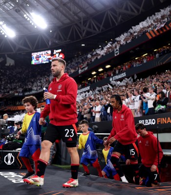 BILBAO, SPAIN - MAY 21: Luke Shaw of Manchester United enters the pitch followed by team mate Leny Yoro prior to the UEFA Europa League Final 2025 between Tottenham Hotspur and Manchester United at Estadio de San Mames on May 21, 2025 in Bilbao, Spain. (Photo by Alex Pantling - UEFA/UEFA via Getty Images)